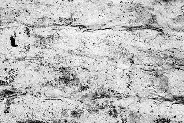 Obraz premium Texture of a brick wall with cracks and scratches which can be used as a background