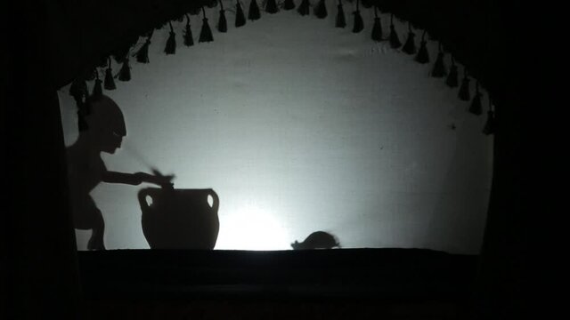 Shadow puppet theater performance for children with silhouette objects
