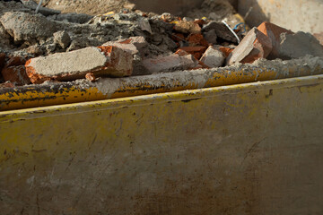 Bricks and rubbish after demolition with rotten and rusty metals.