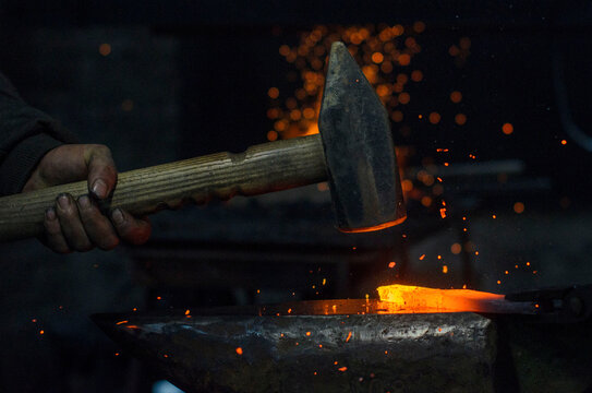 blacksmith working on a metal