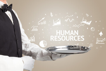 Waiter serving business idea concept with HUMAN RESOURCES inscription