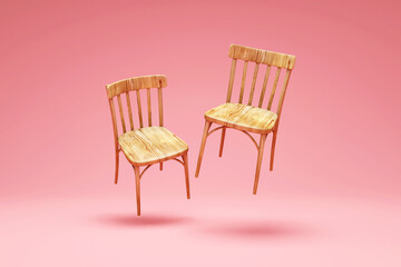 Group of Wooden Chairs levitation on pink studio background
