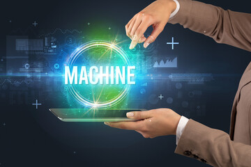 Close-up of a touchscreen with MACHINE inscription, new technology concept
