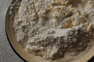 
Flour added to the dough on top. 
The dough is kneaded for baking cookies
