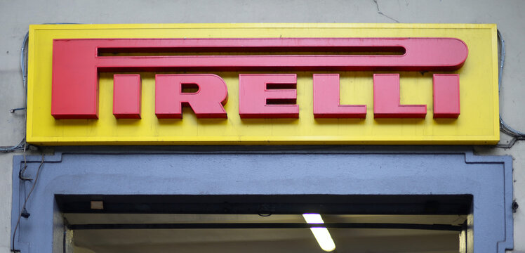 FLORENCE, ITALY &ndash; OCTOBER 17, 2019: Pirelli logo on old garage wall. The brand was founded in Milan in 1872 and is a multinational company famous for manufacturing tires