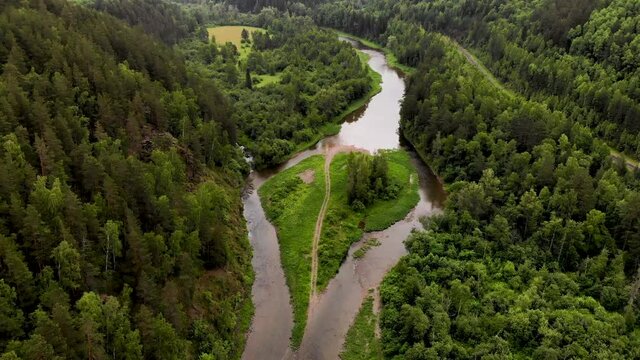 Nature Of Bashkortostan. A flight over the river and an island in the shape of a heart. Ural nature.