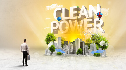 Rear view of a businessman standing in front of CLEAN POWER inscription, Environmental protection concept