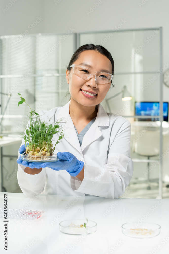 Sticker happy laboratory worker holding petri dish with green lab-grown soy sprouts