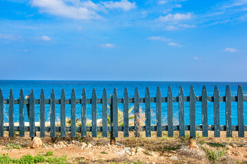 Wooden fence over the beach 
