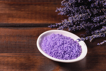Obraz na płótnie Canvas Lavender bath salt on the table close up.
