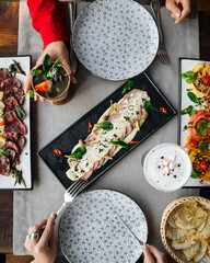Top view on restaurant table served with European fusion cuisine appetizers