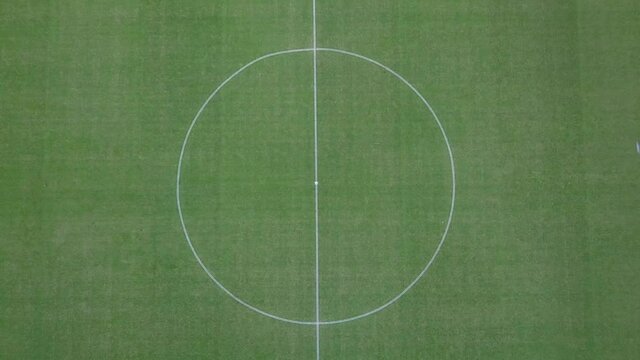 Aerial view of a center of soccer field. Centerline on grass of soccer and football field.
