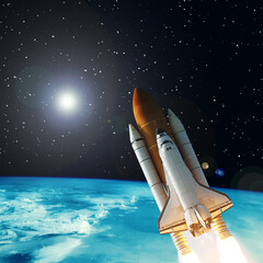 Naklejka premium Rocket above the earth. Stars. Space concept. The elements of this image furnished by NASA.