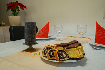 Set table for a Christmas dinner with traditional Hungarian cake