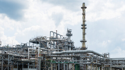 Industrial furnace and heat exchanger cracking hydrocarbons in factory on blue sky background, Close-up of equipment in petrochemical plant. Industry and ecological problem concepts.