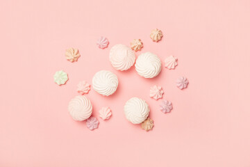 Sweets on a pastel pink background. Composition of confectionery. Flat lay, top view. Banner