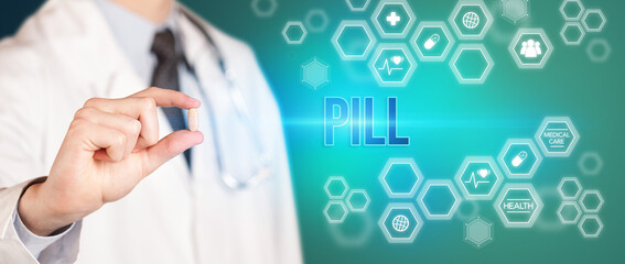 Close-up of a doctor giving you a pill with PILL inscription, medical concept