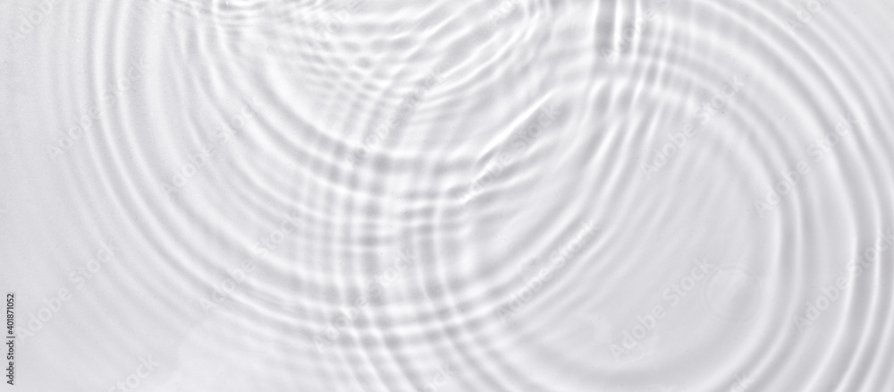 Poster a top view closeup of waterdrops falling on the surface and forming a circular shape