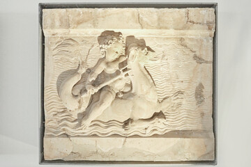 Fototapeta na wymiar Nice little reliefs with putti and sea monsters.