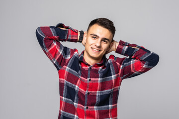 Confidence and coquettish concept. Portrait of charming young man, smiling broadly with...