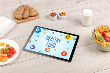 Healthy Tablet Pc compostion with HEALTHY FOOD inscription, weight loss concept