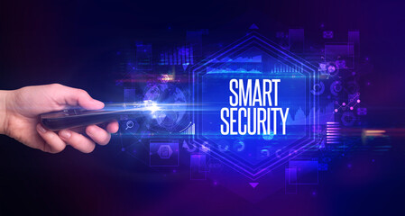 hand holding wireless peripheral with SMART SECURITY inscription, cyber security concept