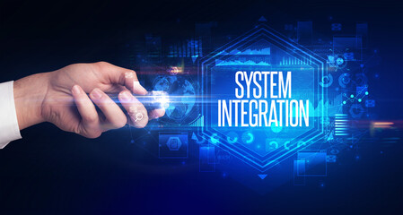 hand holding wireless peripheral with SYSTEM INTEGRATION inscription, cyber security concept