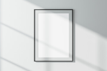Blank white frames on concrete wall.