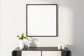 Clean home interior with blank frame on wall.