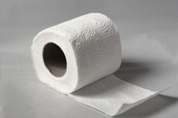single isolated white toilet paper roll
