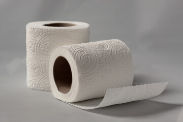 two white toilet paper rolls on the white background
