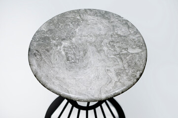 Round serving tray made of marble on a white background. The view from the top. top isolated on white background Copy space