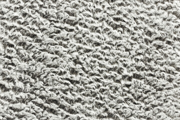 Gray carpet texture. Closeup fiber background. Soft plush fabric pattern. Furry rug background.
