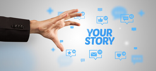 Close-Up of cropped hand pointing at YOUR STORY inscription, social networking concept