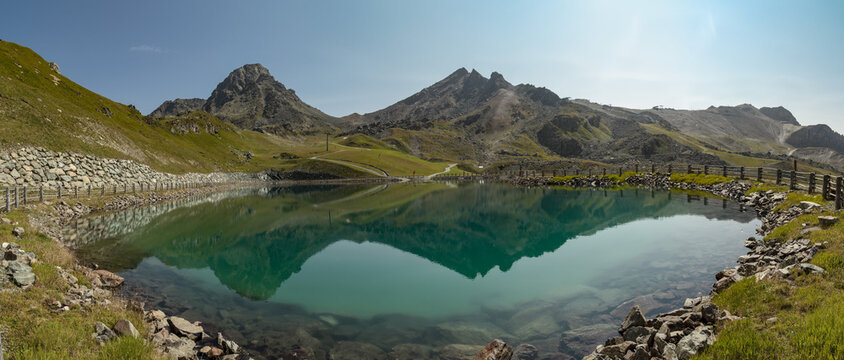 Panoramatic view from Tirol Alps by Ischgl with a lake