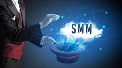 Magician is showing magic trick with SMM abbreviation, modern tech concept