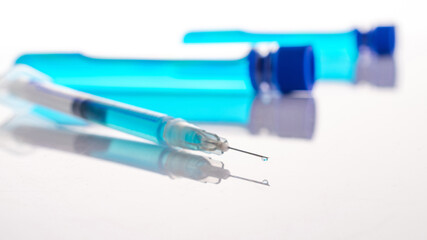 Vial syringe. Medical syringe with needle for protection flu virus and coronavirus. Covid vaccine on white. Medicine concept vaccination hypodermic injection treatment.