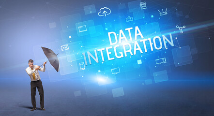 Businessman defending with umbrella from cyber attack and DATA INTEGRATION inscription, online security concept
