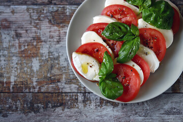 Soft focus. Classic Caprese salad on a plate.