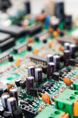 Obraz premium Macro close up of computer green pc motherboard microchip