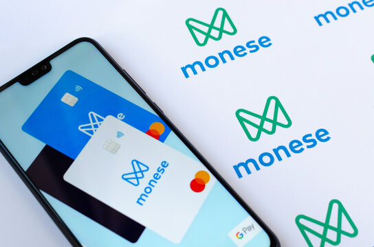 Stone, Staffordshire / United Kingdom - July 24 2019: Monese bank app on the smartphone screen and a printed brochure with the bank logos. Editorial illustrative photo.