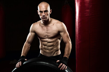 Mixed Martial Arts Fighter in the Gym wearing boxing Gloves