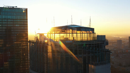 Warsaw, Poland 01.11.2020 Golden sunrise over the Warsaw office tower Spektrum tower and club The...