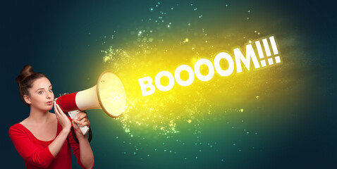 Young woman yelling to loudspeaker with BOOOOM!!! inscription, modern media concept