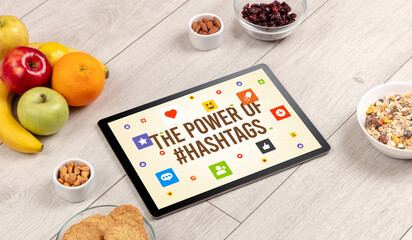 Healthy Tablet Pc compostion with THE POWER OF #HASHTAGS inscription, Social networking concept