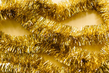 Festive Gold Garland Sparkles. Holiday background. Flat lay, top view.