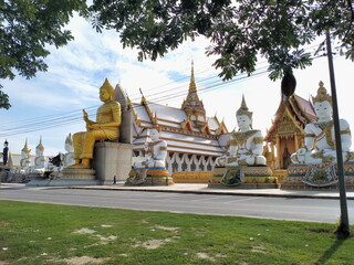 Big Buddha Statue with stupa at Wat Nong Pong Nok, temple. Nakhon Pathom province, Thailand.
