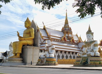 Big Buddha Statue with stupa at Wat Nong Pong Nok, temple. Nakhon Pathom province, Thailand.