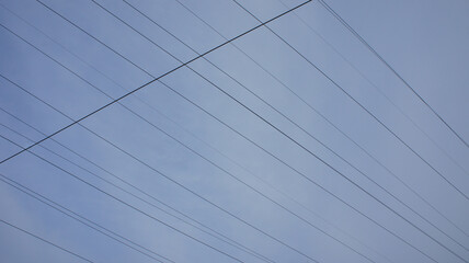 Line of electro gears on the background of the sky, wires