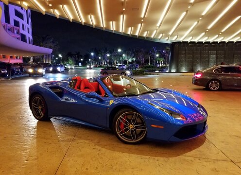 Hollywood, Florida, U.S.A - January 2, 2020 - A blue Ferrari by the entrance of Seminole Hard Rock Cafe and Casino